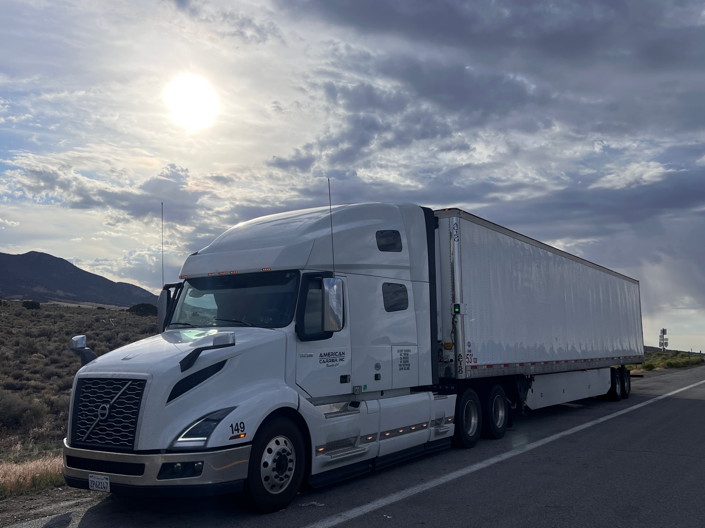 American Carrier, Inc. Volvo VNL 760 tractor #149 with a 53' dry van trailer on the road